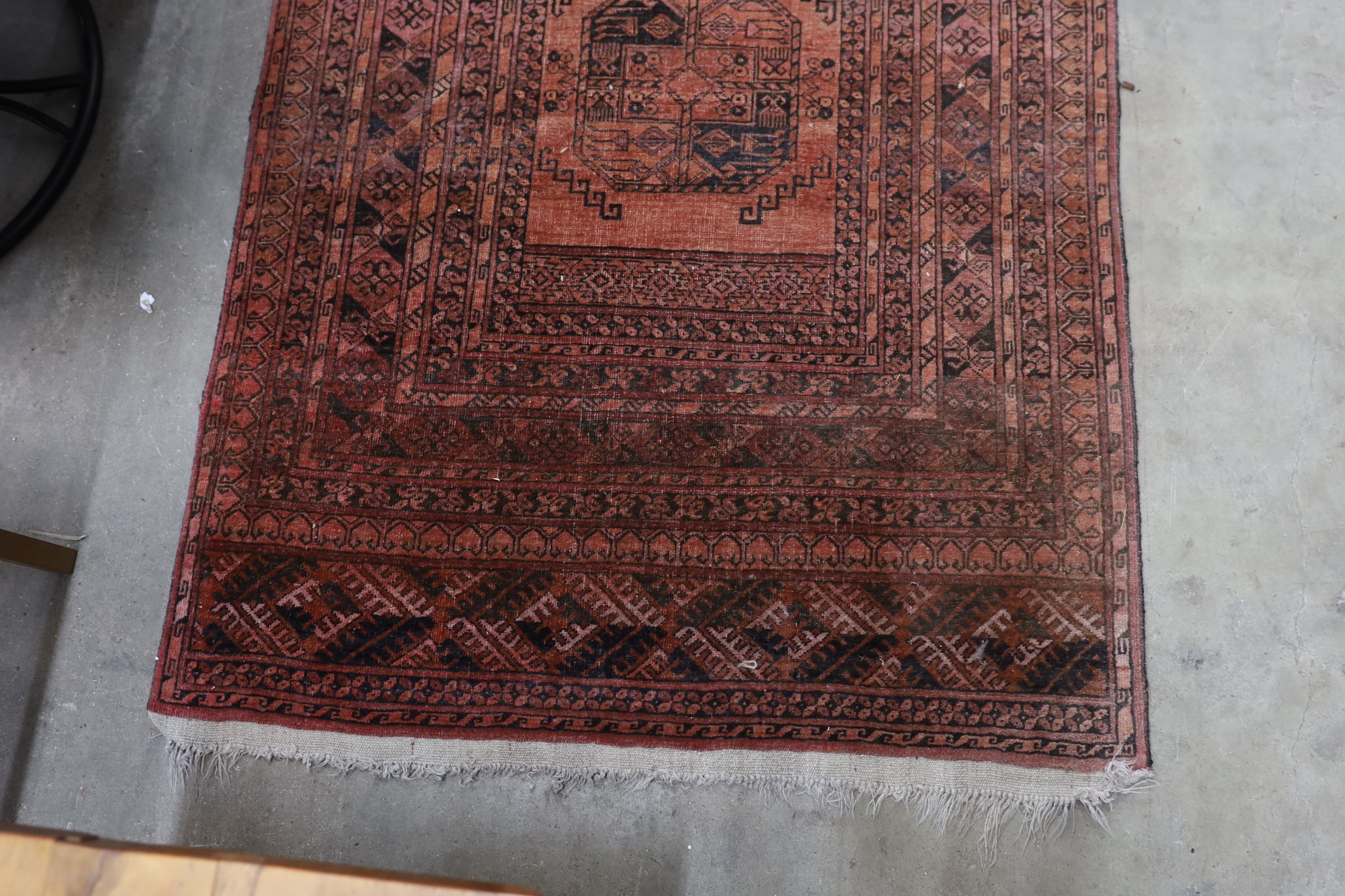 An antique Tekke rug 138cm x 66cm and an Afghan runner 280cm x 104cm.